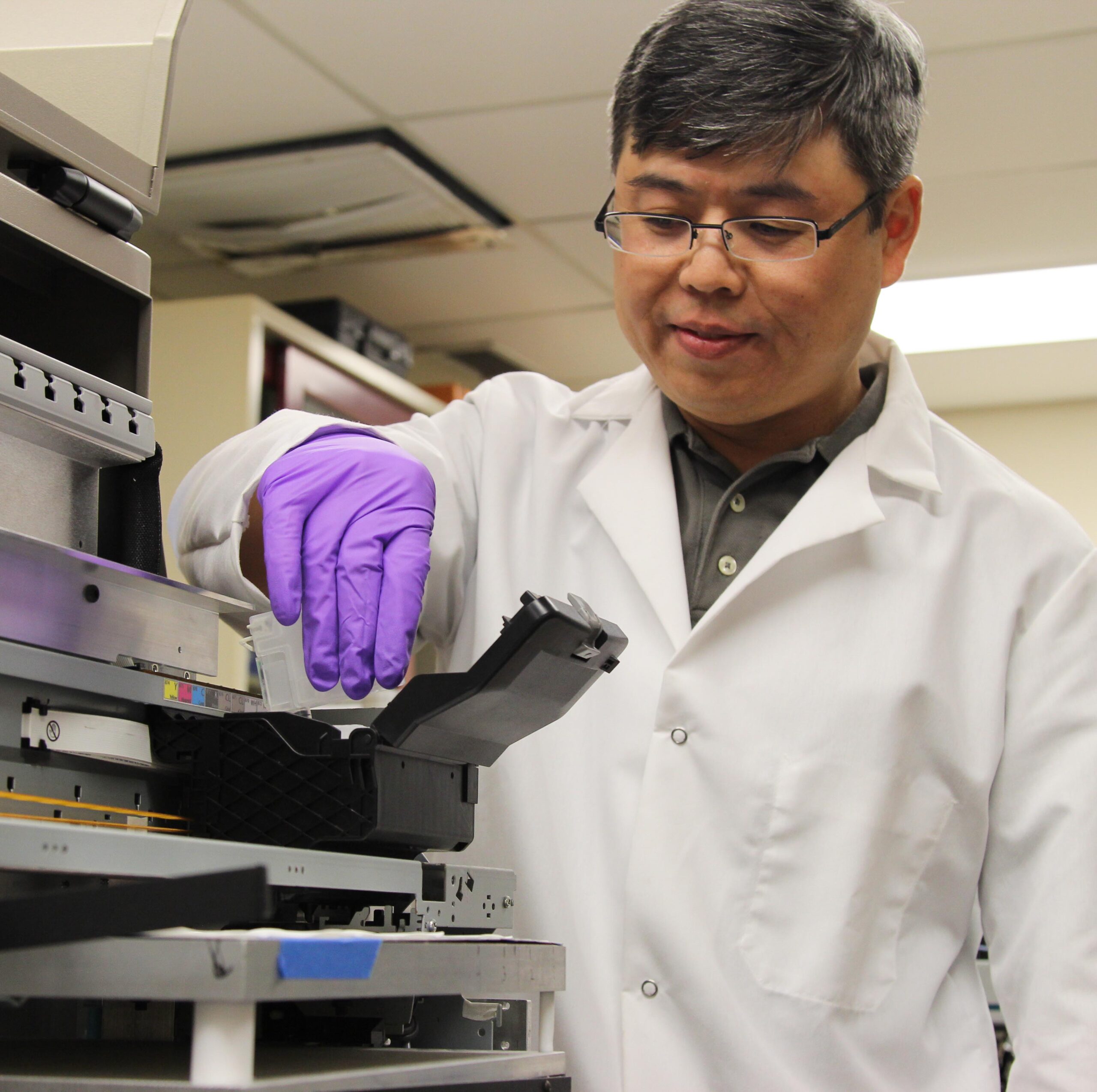 SMC faculty fellow working in a DEVCOM ARL laboratory environment.